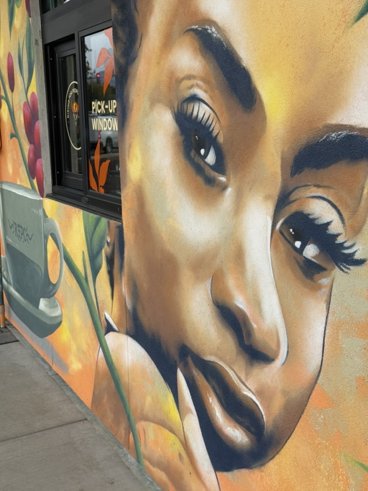 Rising For People mural inside the Midtown Reno café