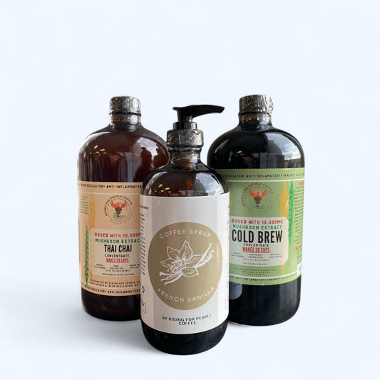 Rising for people coffee— Happy Mushroom Collection: 32oz Happy Mushroom Thai Chai Concentrate, 32oz Happy Mushroom Cold Brew Concentrate, 16oz French Vanilla Syrup