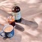 Happy Mushroom concentrated Cold Brew coffee - Rising For People Coffee Co.CoffeeRising For People Coffee Co.Rising For People Coffee Co.Rising For people coffee cold brew bottle. Specialty gourmet concentrated cold brew dosed with lions mane, Chaga, Cordyceps, turkey tail, Reishi. Latte, Cappuccino, Coffee shop, Coffee shop near, Coffee near me, Roasted coffee, Speciality coffee, Green coffee, Black coffee, Espresso machine, French press, Espresso, Takeout coffee near
