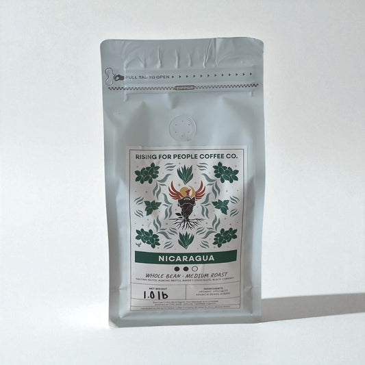 Nicaragua Coffee Roast - Rising For People Coffee Co.CoffeeRising For People Coffee Co.Rising For People Coffee Co.C-NICARAGUA-WH-1LB-KRCoffee package from Rising for People Coffee Co. with 'Nicaragua' label on a white background Nicaragua Coffee Roast - Rising For People Coffee Co.CoffeeRising For People Coffee Co.Rising For People Coffee Co.C - NICARAGUA - WH - 1LB - KRLatte, Cappuccino, Coffee shop, Coffee shop near, Coffee near me, Roasted coffee, Speciality coffee, Green coffee, Black coffe
