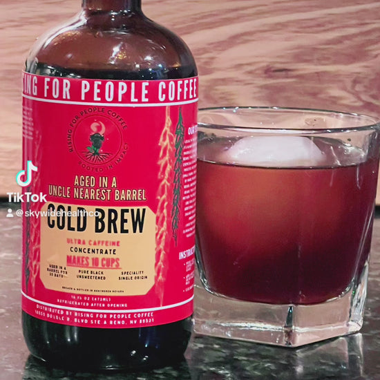 Rising for People Coffee cold brew bottle- organic specialty Guatemala coffee aged in an uncle nearest whiskey barrel for 30 days, roast light, ultra caffeine 