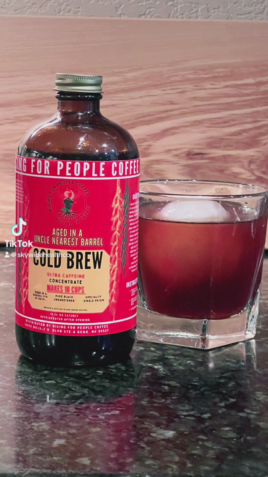 Rising for People Coffee cold brew bottle- organic specialty Guatemala coffee aged in an uncle nearest whiskey barrel for 30 days, roast light, ultra caffeine 